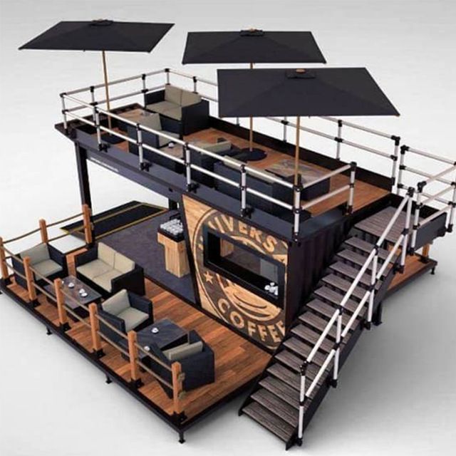 an image of a coffee shop with umbrellas on the roof and stairs leading up to it