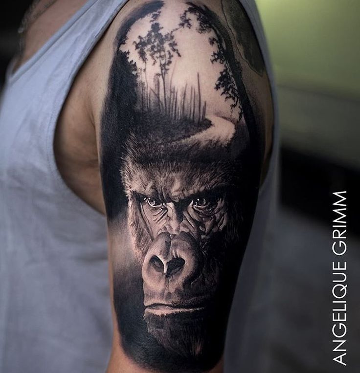 a man with a gorilla tattoo on his arm