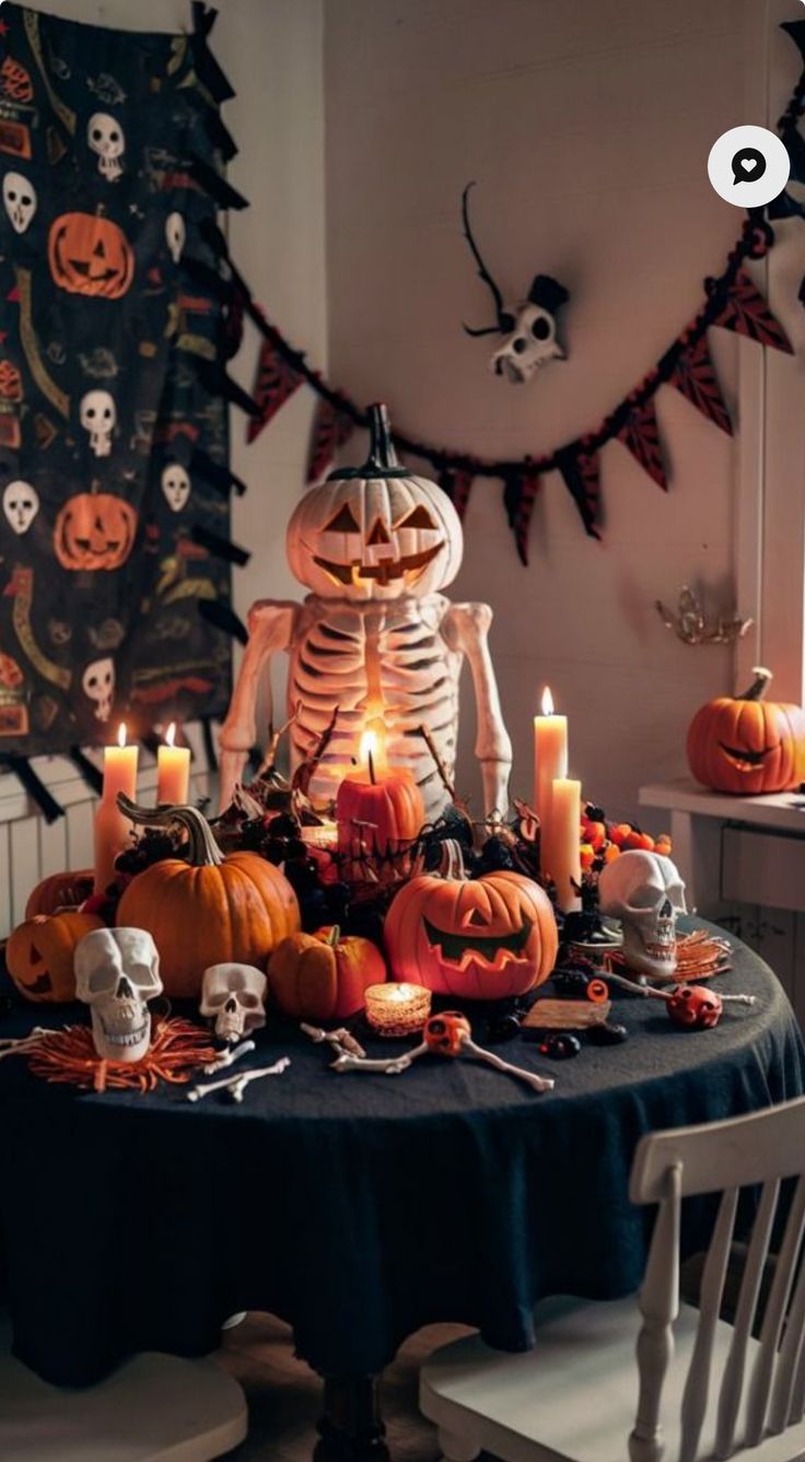 a table topped with lots of halloween decorations