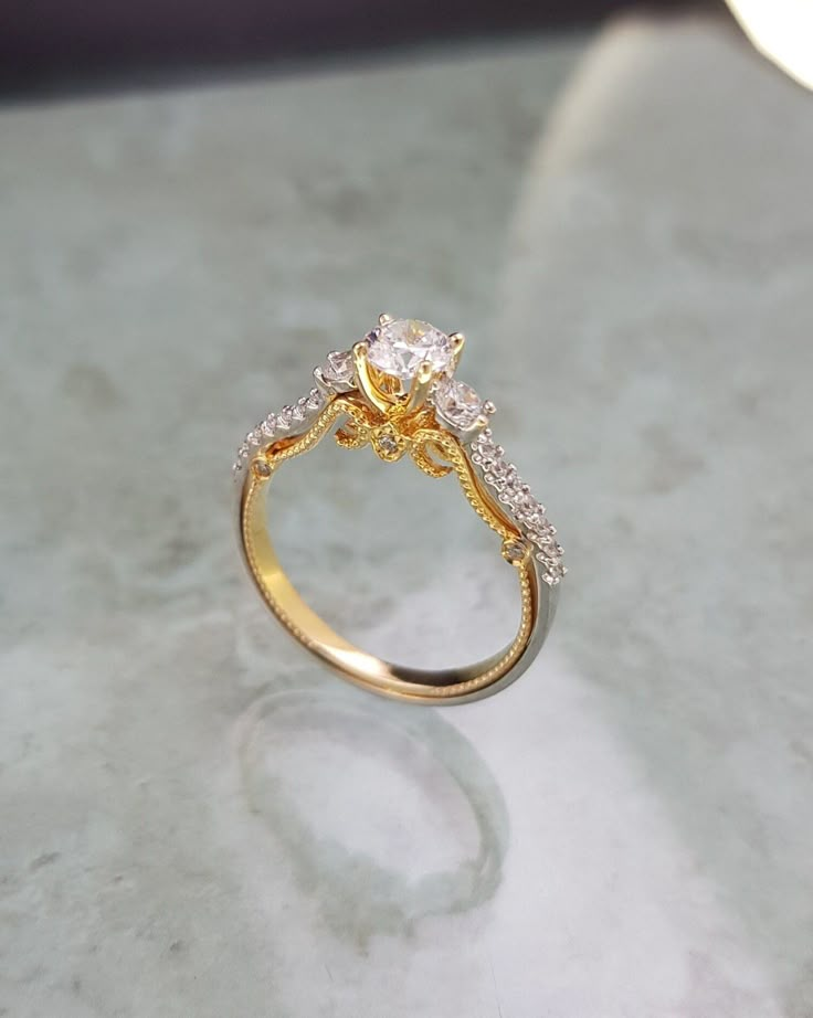 a diamond ring sitting on top of a table