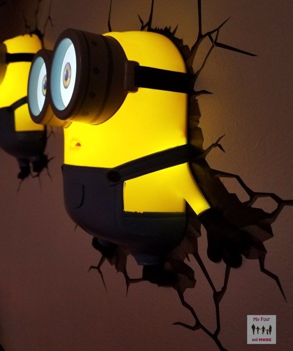 two yellow and black minion lights on the wall