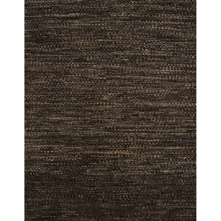 an area rug with dark brown and tan colors on the carpet, it looks like woven fabric