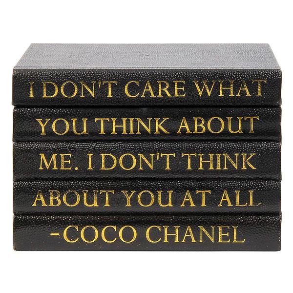 three black books with gold lettering on the front and back, each containing an individual's own quote