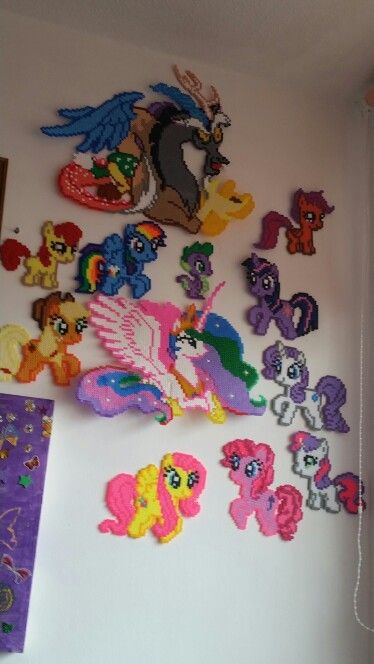 the wall is covered with many little ponys