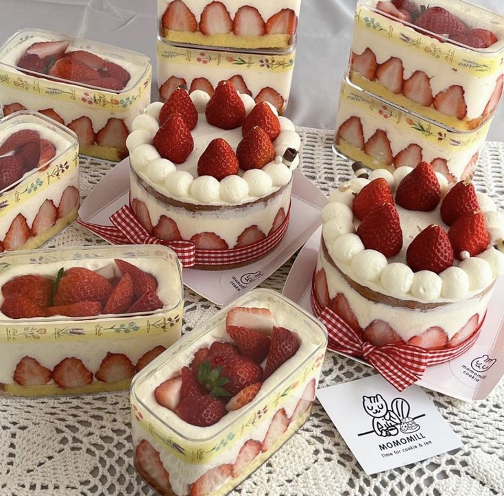 there are many cakes with strawberries on the top one is made out of cake