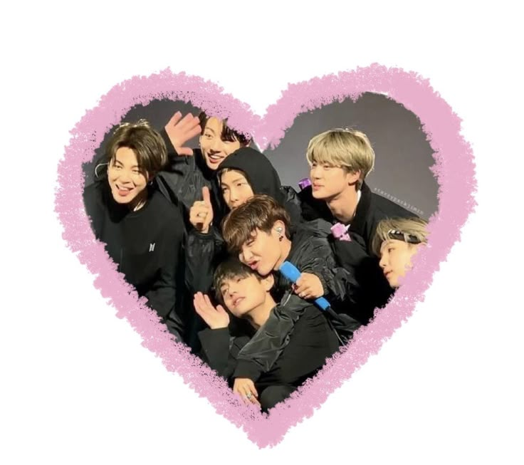 the group is posing in front of a heart shaped photo