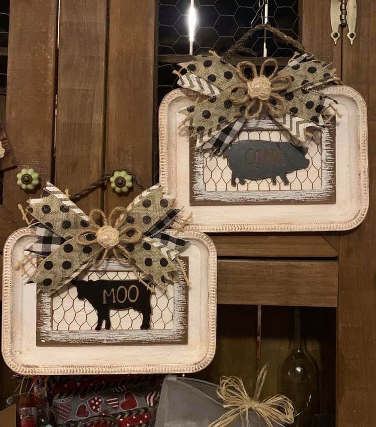 two framed pictures with farm animals on them