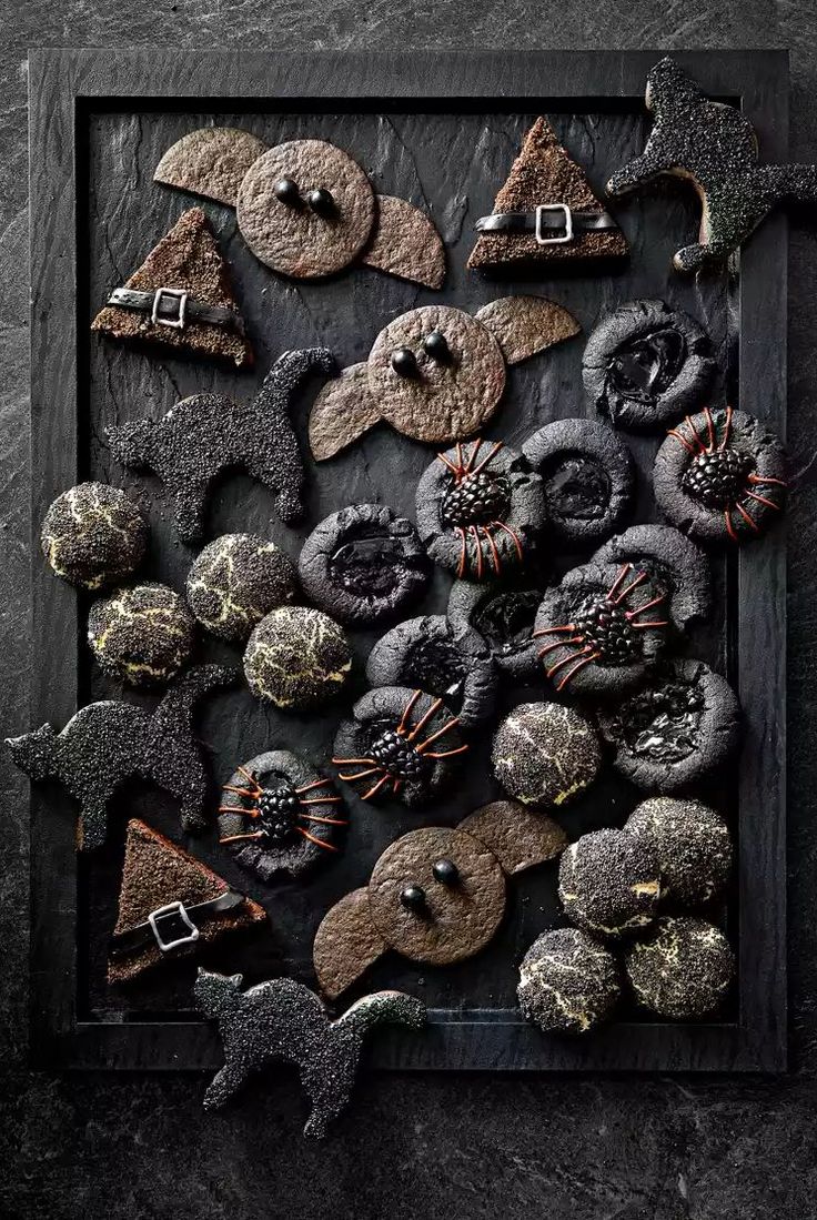 an assortment of buttons and decorations on a black background