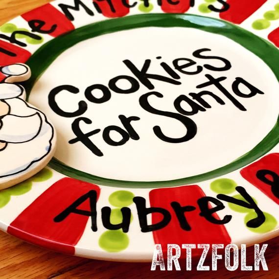 there is a plate with cookies on it and the words cookies for santa written in black