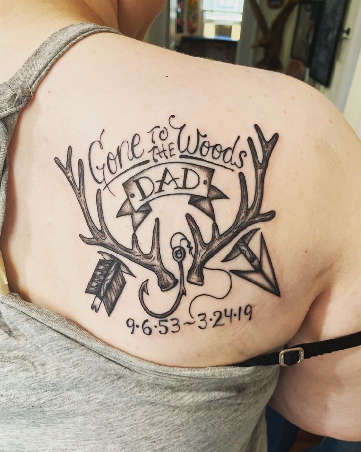 the back of a woman's shoulder with an arrow and some words on it