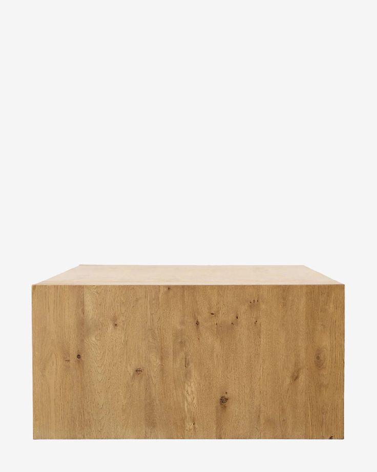 a wooden shelf sitting on top of a white wall