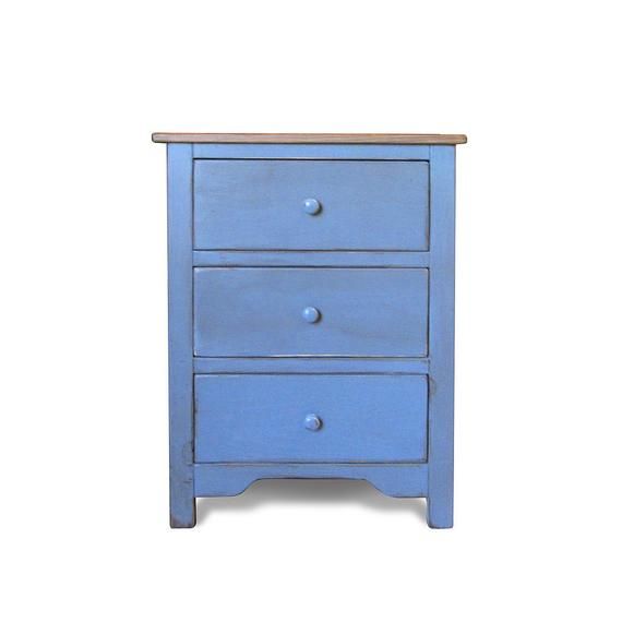 a small blue dresser with three drawers