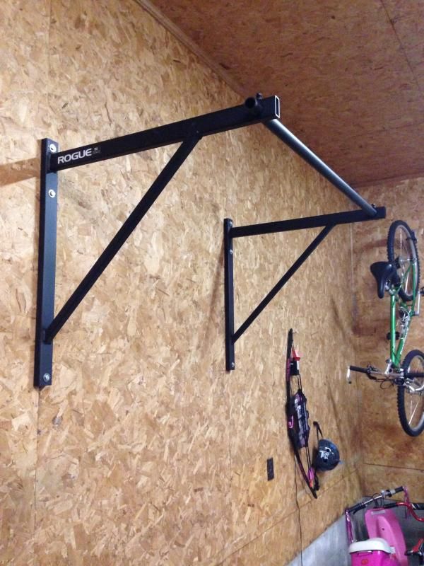 there is a bike hanging on the wall