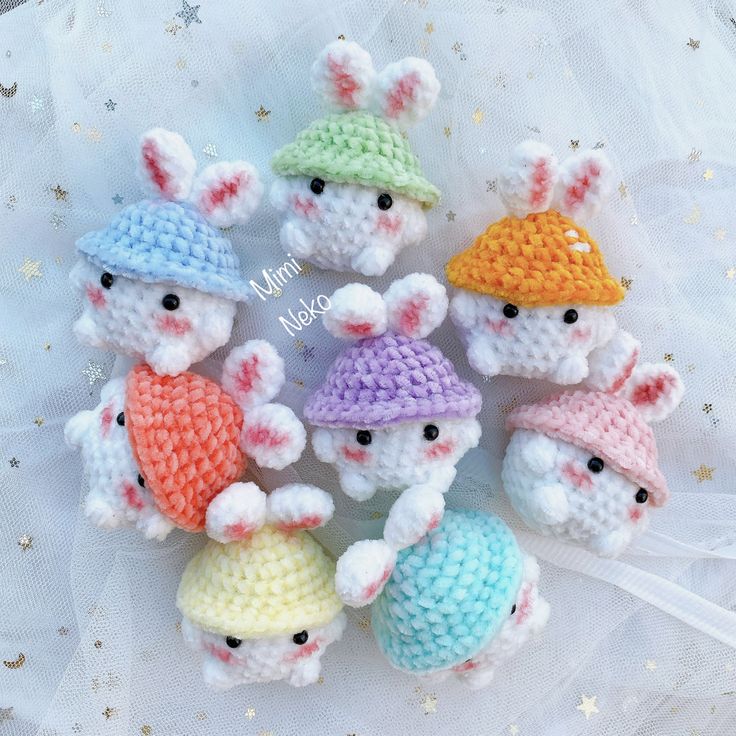 small crocheted stuffed animals are arranged in a circle