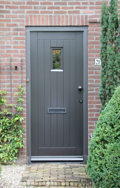 the front door to a brick house