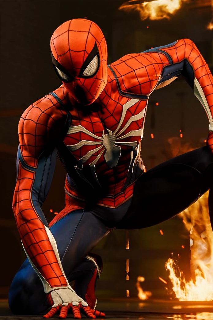 the amazing spider - man is posing in front of a fire