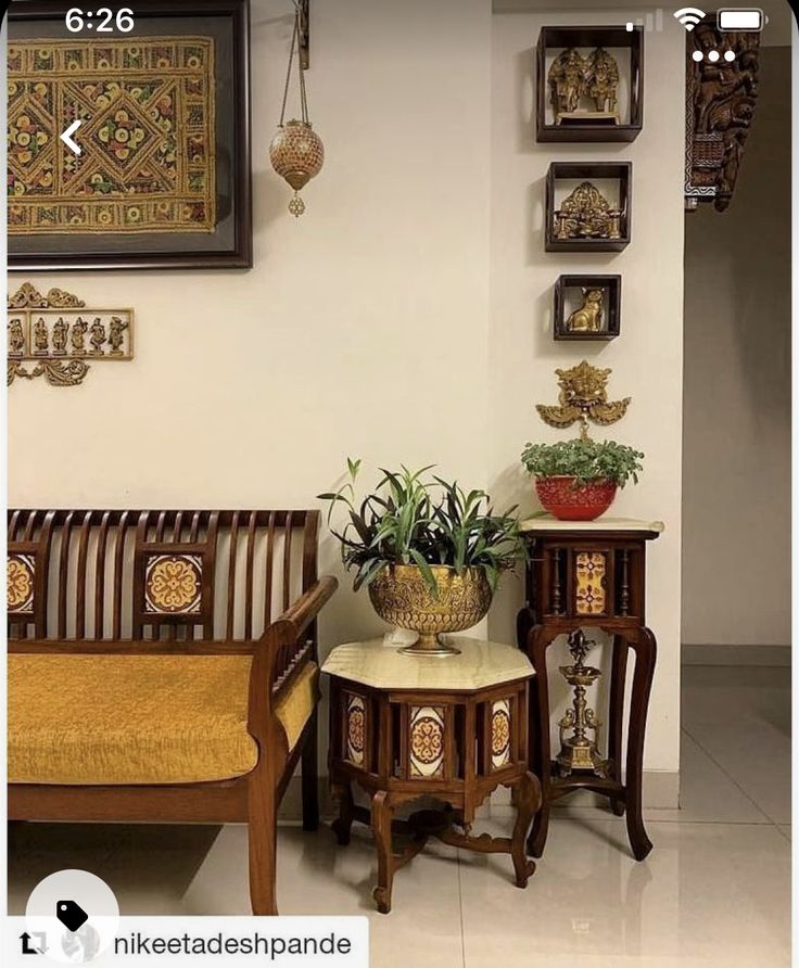 a living room filled with furniture next to a wall mounted art on it's walls