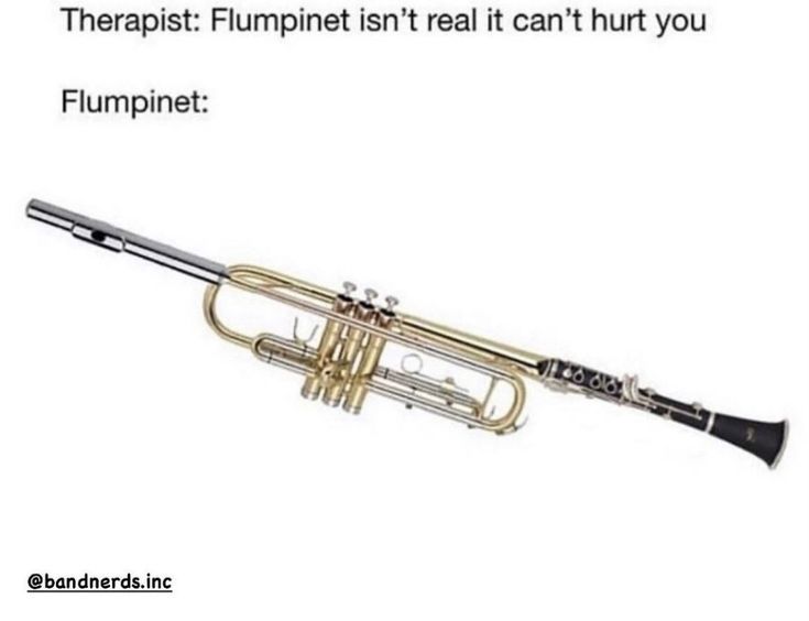 a trumpet that is sitting on top of a white sheet with the caption, there is