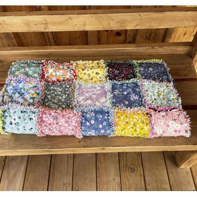 This charming vintage style floral quilt is handcrafted from 100% cotton fabrics, featuring a variety of floral prints and solid colors. The quilt measures 54" x 60", making it perfect for a cozy lap or sofa throw. Lightweight but durable and will last for year. This quilt is done in rag style and has been washed once after the sewing was completed to start the rag ravel process. Machine washable tumble dry low. Granny chic, cottage core style, reminiscent of grandma's soft quilts. Folk N Funky Cottage Core Style, Oversized Throw Blanket, Reversible Blanket, Woven Throw Blanket, Knit Throw Blanket, Chic Cottage, Granny Chic, Floral Quilt, Fur Throw