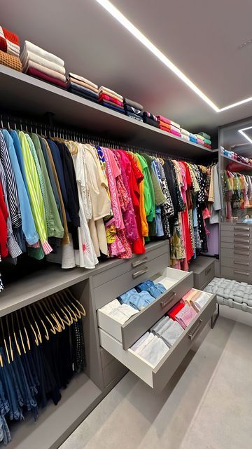 a clothing store with lots of clothes on racks