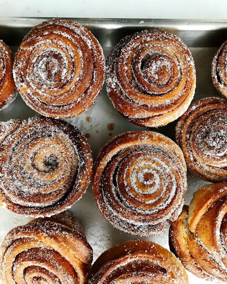 many different types of pastries on a tray