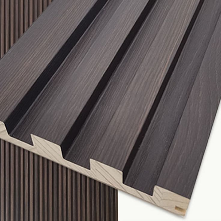 an image of some wood planks with different colors and patterns on them, including black