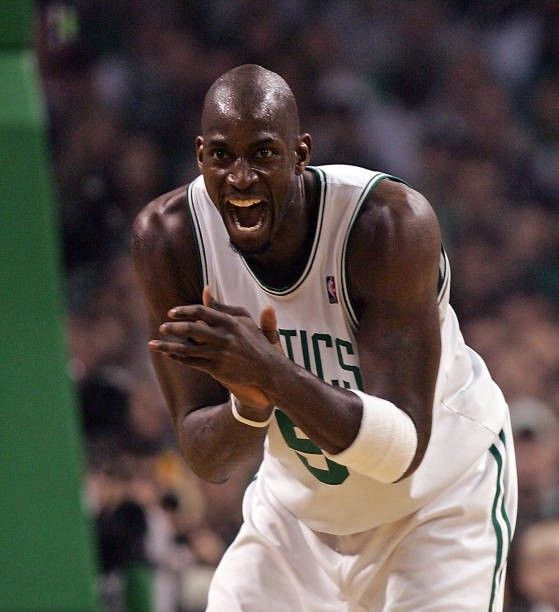 a basketball player holding his hand out in front of him