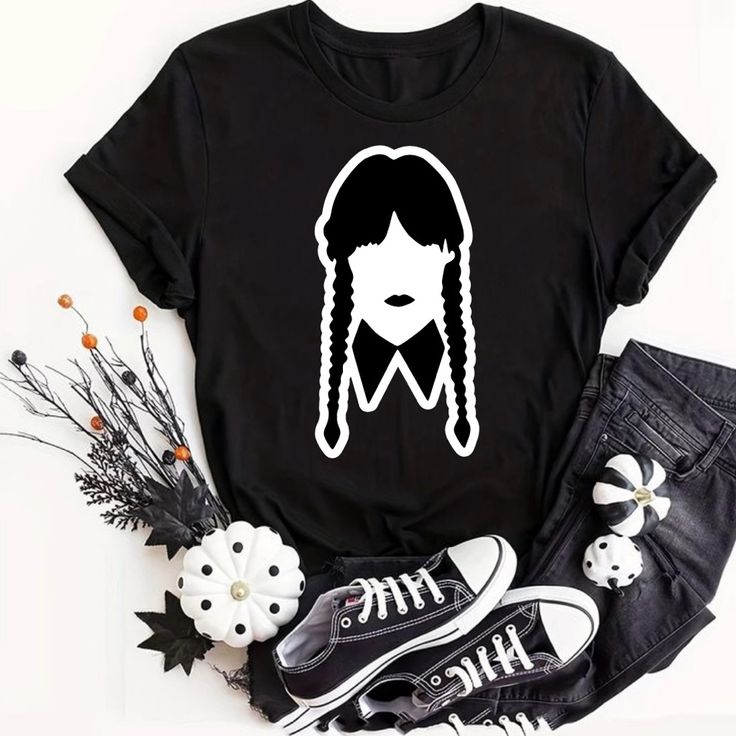 Wednesday Addams Halloween T-Shirt Unisex Unisex T-Shirt Customized This Preshrunk 100% Cotton Tee Brand: Gildan Adult Size Most 100% Cotton Preshrunk Machine Wash Cold With Like *** Let Me Know Your Size Before Purchase ** Or Will Be Shipped In The Size That Is Posting Available Sizes: Small/ Medium/ Large/ Extralarge/ 2xl/ 3xl Measurements Are Shown In Pictures! You Can Ask For Other Sizes Or Colors Before Purchase! I Can Customize Special Orders By Request, Remember The Price Depends On The D Halloween Black T-shirt With Character Print, Black Punk T-shirt With Character Print, Emo Cotton T-shirt With Graphic Design, Halloween Graphic Design Short Sleeve T-shirt, Emo Black T-shirt With Graphic Design, Punk Style Black Top For Halloween, Halloween Band Merch T-shirt With Graphic Design, Casual Halloween Graphic Tops, Casual Graphic Tops For Halloween