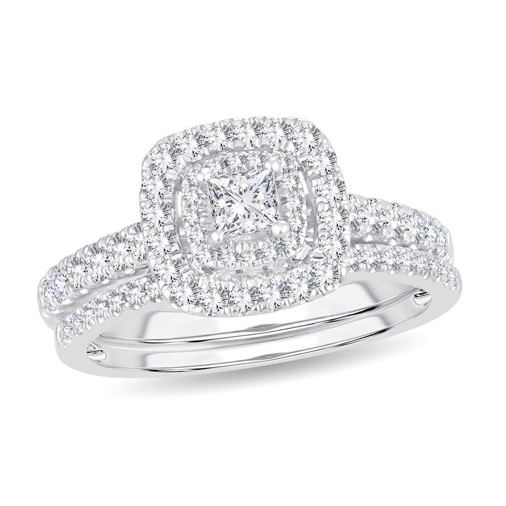 a diamond engagement ring set on top of a white background