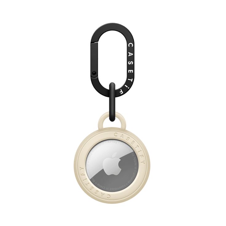 an apple id badge hanging from a black and white keychain