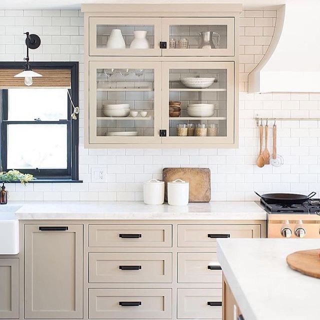 a kitchen filled with lots of white counter top space