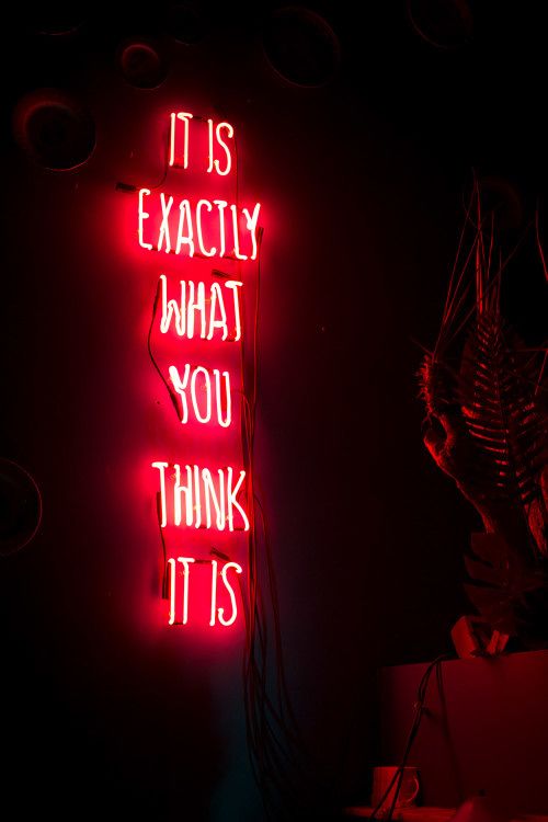 a neon sign that says it is exactly what you think it is