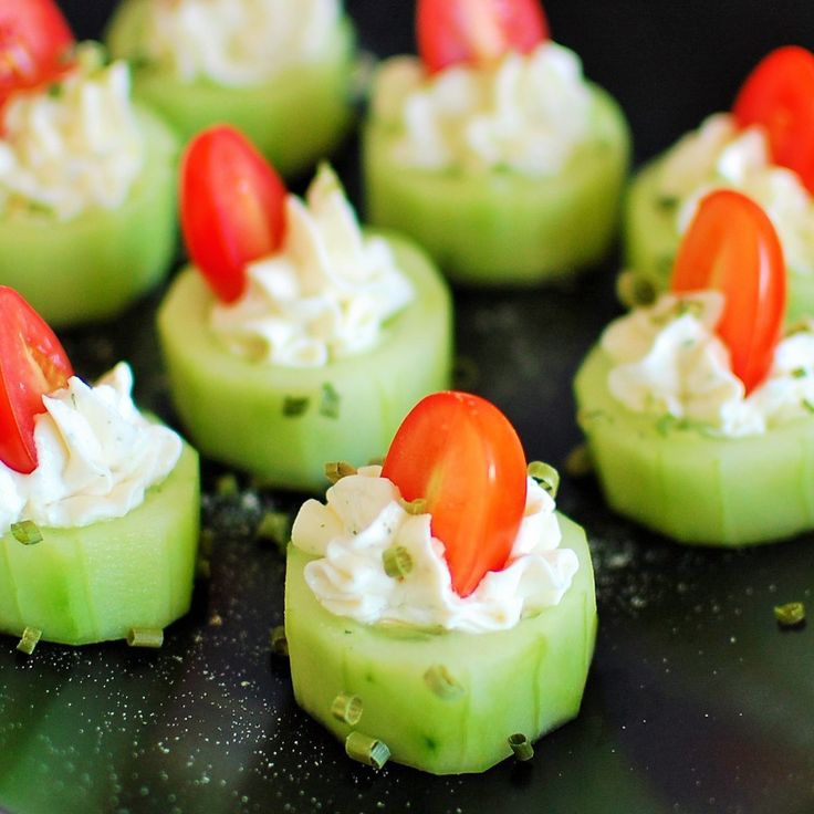 small appetizers with tomatoes and cream cheese on them are ready to be eaten