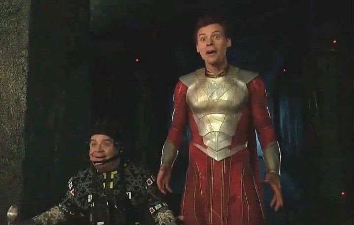 two men in costumes standing next to each other