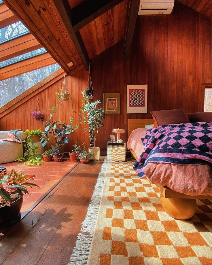 a bedroom with wood paneling and plants on the floor