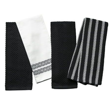 four black and white towels on top of each other, one with an arrow design