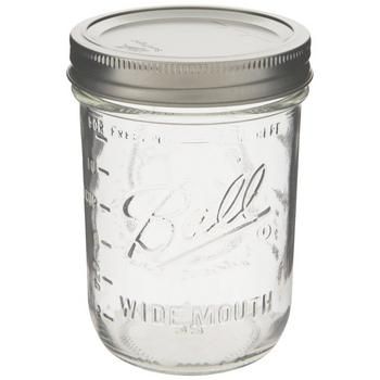 a glass mason jar with a metal lid