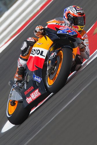 a person riding a motorcycle on a race track