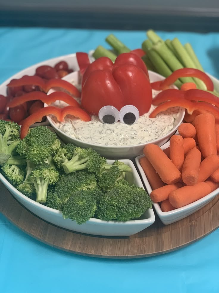 a plate filled with carrots, broccoli and other vegetables