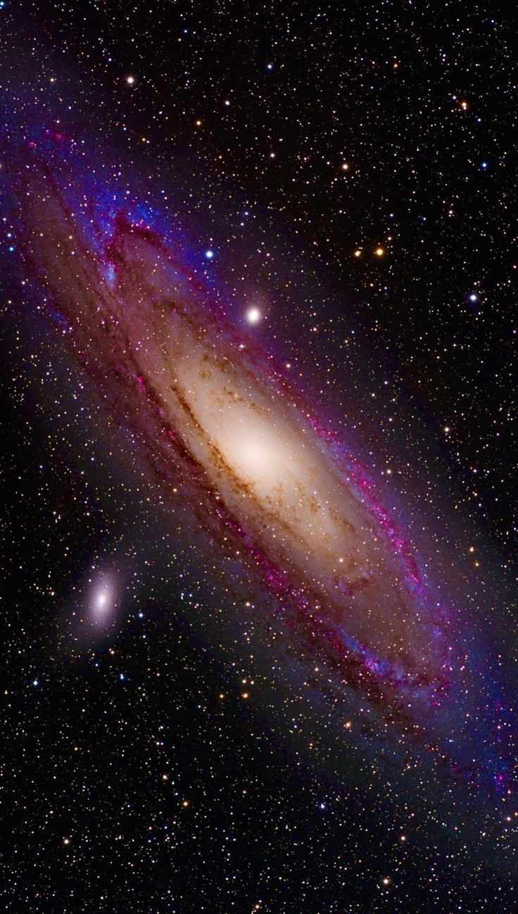 the andromeda galaxy is shown in this image, with an arrow pointing to it