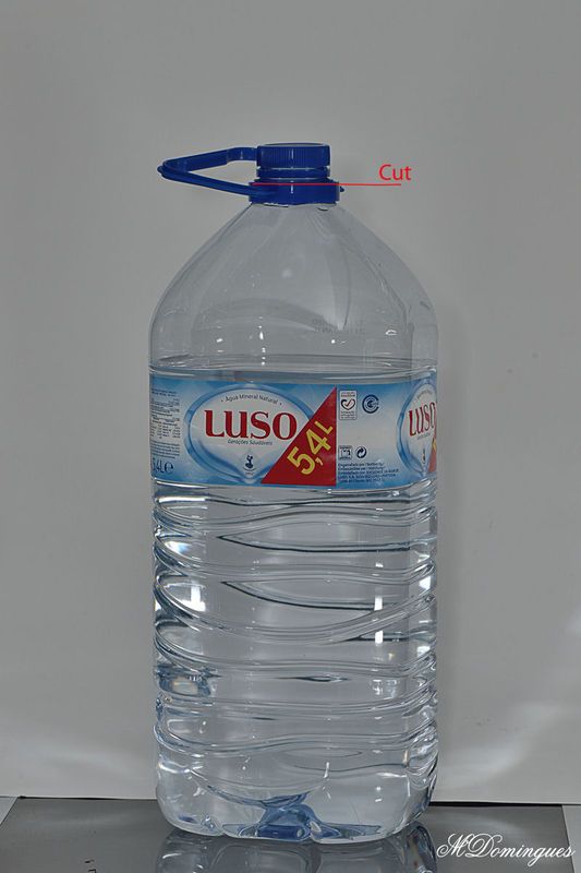 a large bottle of water sitting on top of a table