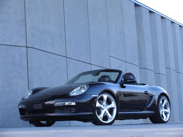 a black sports car parked in front of a building