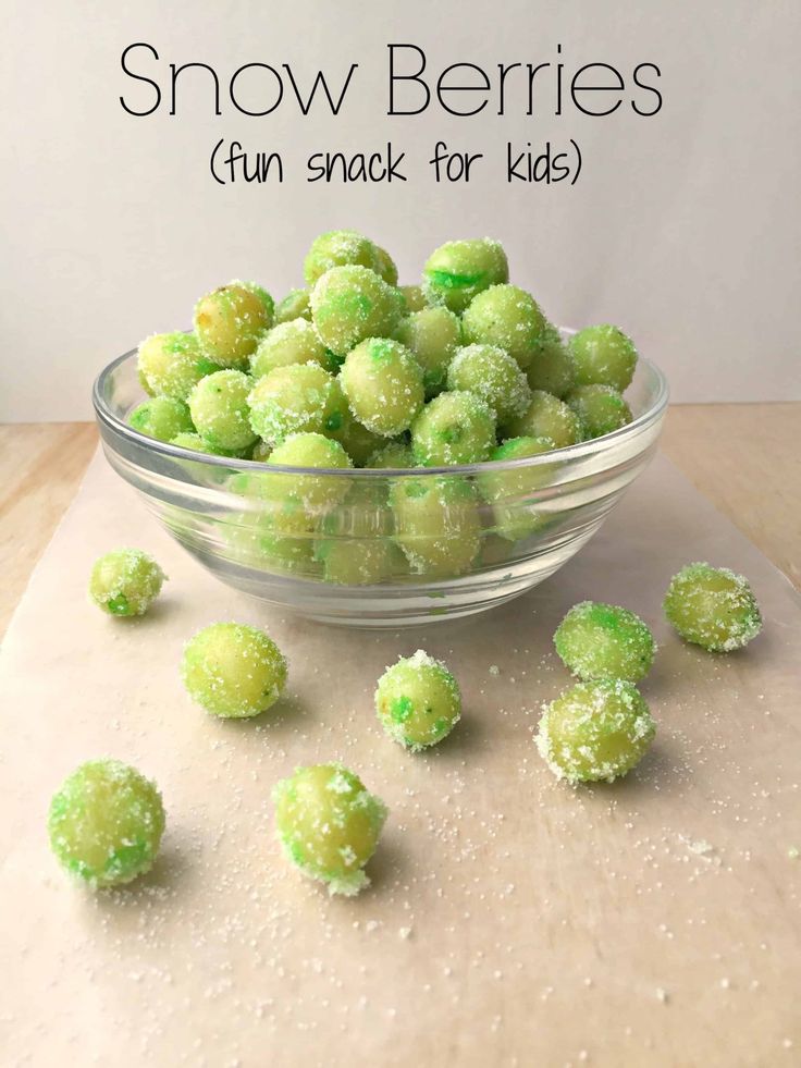 snow berries in a glass bowl on top of a cutting board with the words fun snack for kids