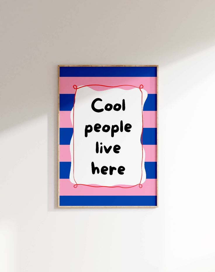 a pink, blue and white framed poster with the words cool people live here