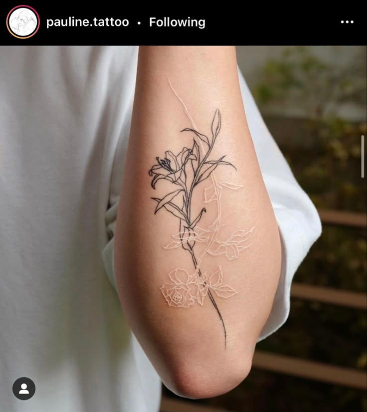 a person with a flower tattoo on their arm