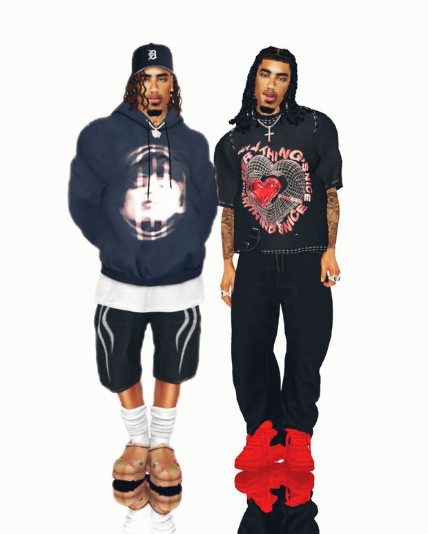 two young men standing next to each other in front of a white background, one wearing a black hoodie