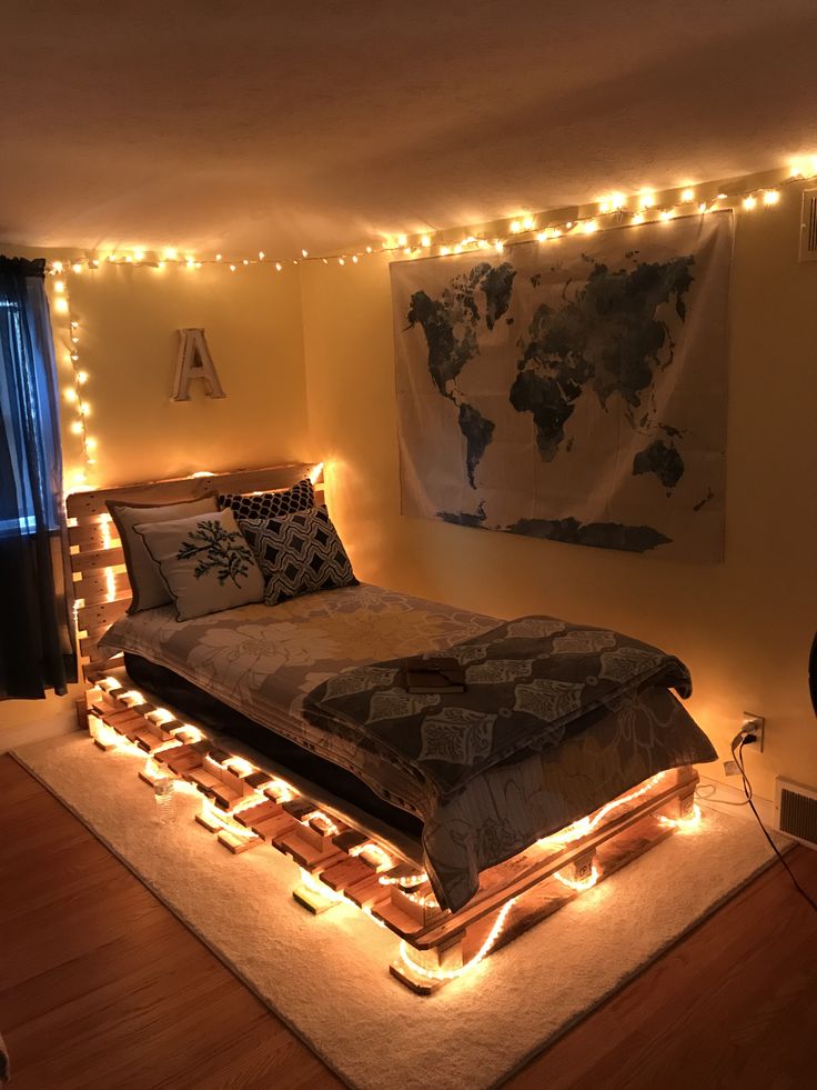 a bed with lights around it in a room