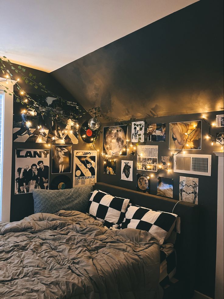 a bedroom with pictures and lights on the wall