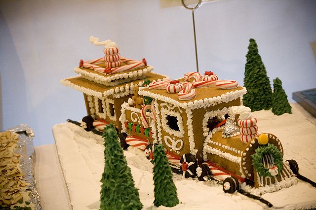 a gingerbread train is decorated with candy canes