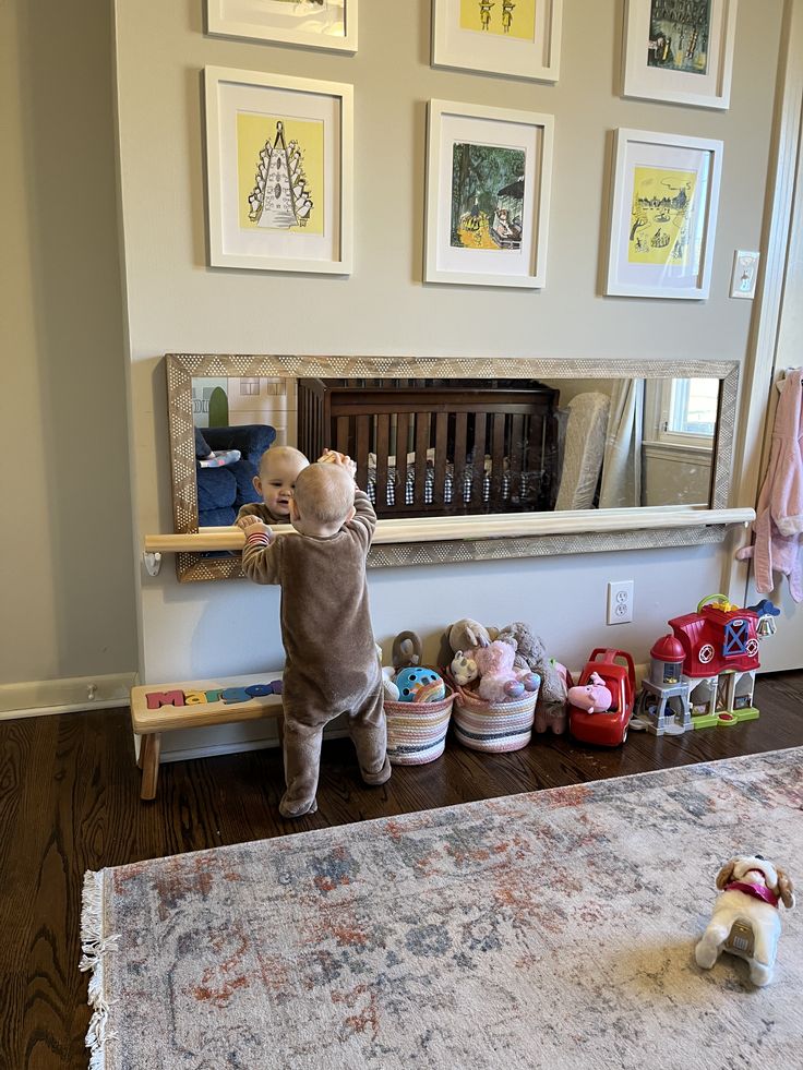 there is a stuffed animal that is standing on the floor in front of a mirror